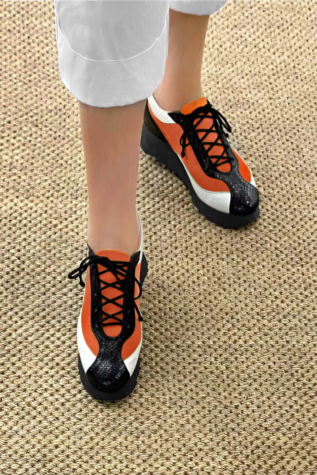 Satin black, clementine orange and off white women's elegant sneakers. Round toe. Low rubber soles. Worn view - Florence KOOIJMAN